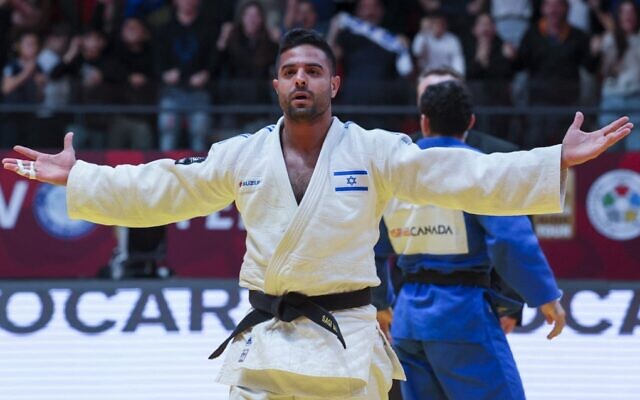 Sagi Muki of Israel (white) reacts after defeating Vedat Albayrak of Turkey (not pictured), at the Tel Aviv Grand Slam Judo Championship on February 17, 2023. (Jack Guez/AFP)