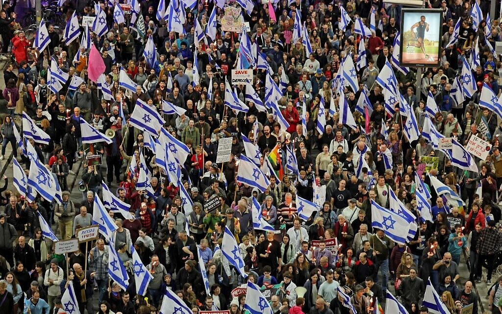 Israelis take part in protests against controversial legal overhaul being touted by the country's government, in Tel Aviv on February 25, 2023. (Jack Guez/AFP)