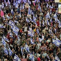 Israelis take part in protests against controversial legal reforms being touted by the country's government, in Tel Aviv on February 25, 2023. (JACK GUEZ / AFP)