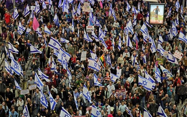 Israelis take part in protests against controversial legal reforms being touted by the country’s government, in Tel Aviv on February 25, 2023. (JACK GUEZ / AFP)
