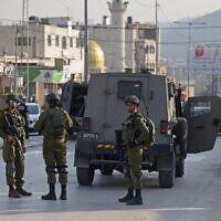 Israeli security forces deploy in Huwara on February 26, 2023 following the deaths of two Israelis in a shooting attack. (AHMAD GHARABLI / AFP)