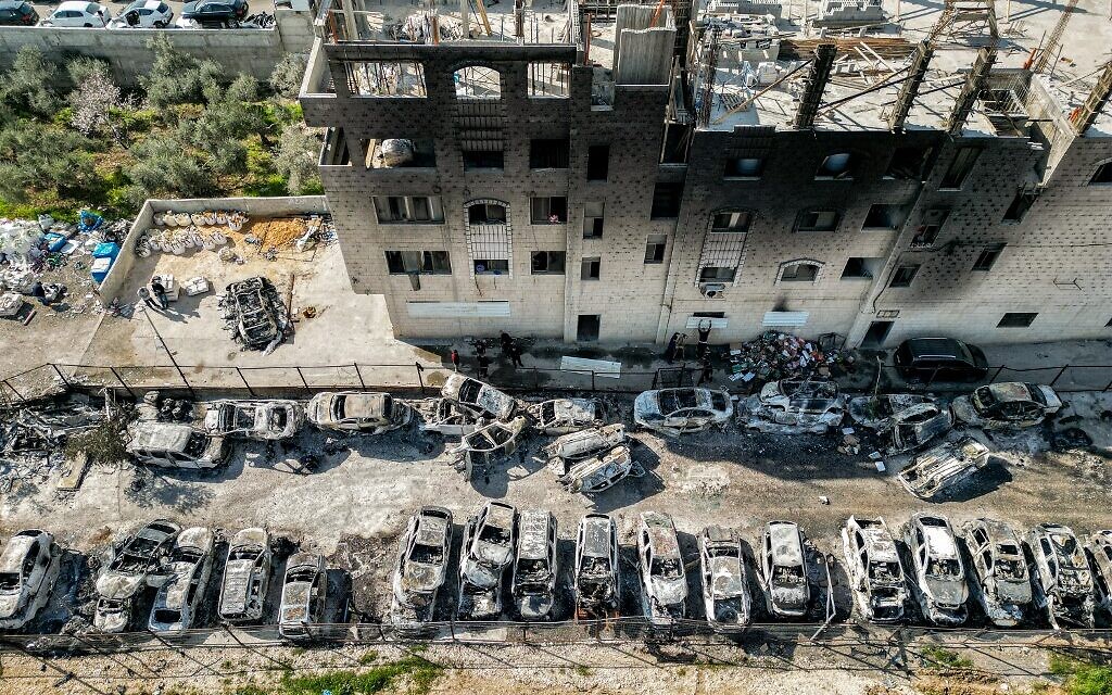An aerial view of a scrapyard where cars were torched overnight in the Palestinian town of Huwara near Nablus in the West Bank, February 27, 2023. (Ronaldo Schemidt/AFP)