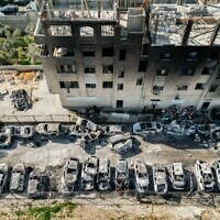 An aerial view of a scrapyard where cars were torched overnight, in the Palestinian town of Huwara near Nablus in the West Bank, February 27, 2023. (RONALDO SCHEMIDT / AFP)
