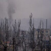 Smoke rises after shelling in the besieged city of Bakhmut amid the Russian invasion of Ukraine, February 27, 2023. (DIMITAR DILKOFF/AFP)