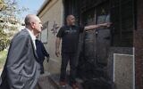 US Special Representative for Palestinian Affairs Hady Amr, left, speaks to residents as he inspects damaged Palestinian property during a visit to Huwara, on February 28, 2023. (JAAFAR ASHTIYEH / AFP)
