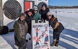 From left to right: Klezmer musicians Greg Schweser, Pat O'Keefe, Josh Rosard, Michael Leville, and Sarah Larsson pose for a picture in front of the Art Shanty popup in Minneapolis. (Courtesy of Josh Rosard)