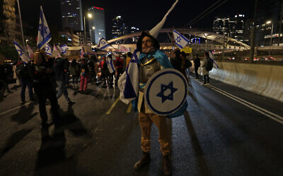 Demonstrators rally on a highway in Tel Aviv to protest the Israeli government's planned overhaul of the judicial system, on February 18, 2023. (Ahmad Gharabli/AFP)