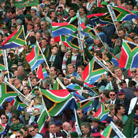 File - This photo taken June 24, 1995 shows crowd at the Ellis Park stadium at the Rugby World Cup final in Johannesburg (AP Photo/John Parkin, file)