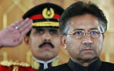Then-Pakistan president Pervez Musharraf listens to the national anthem before being sworn in as the country's civilian president at President House in Islamabad, Pakistan, on November 29, 2007. (B.K.Bangash/AP)