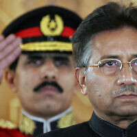 Then-Pakistan president Pervez Musharraf listens to the national anthem before being sworn in as the country's civilian president at President House in Islamabad, Pakistan, on November 29, 2007. (B.K.Bangash/AP)