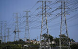 Illustrative: Power transmission towers stand near homes in Redondo Beach, California, September 7, 2022. (AP Photo/ Jae C. Hong)