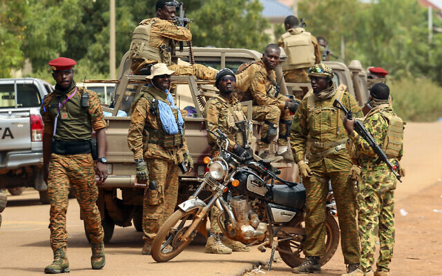 Illustrative: Soldiers loyal to Burkina Faso's latest coup leader Capt. Ibrahim Traore gather outside the National Assembly as Traore was appointed Burkina Faso's transitional president in Ouagadougou, Burkina Faso, Friday, October 14, 2022. (AP Photo/Kilaye Bationo)