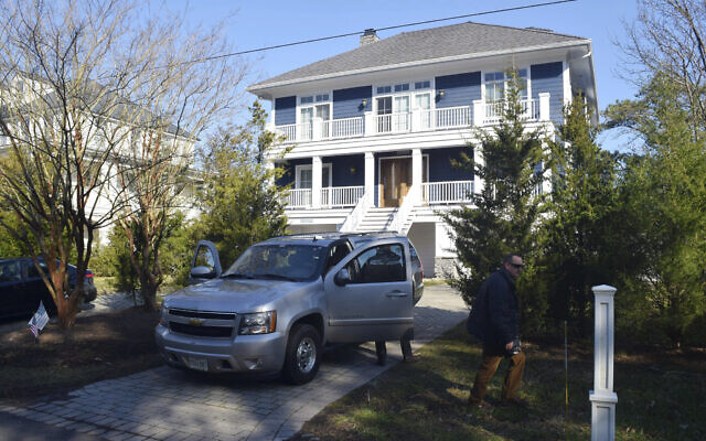 US Secret Service agents are seen in front of Joe Biden's Rehoboth Beach, Del., home on Jan. 12, 2021. (Shannon McNaught/Delaware News Journal via AP, File)