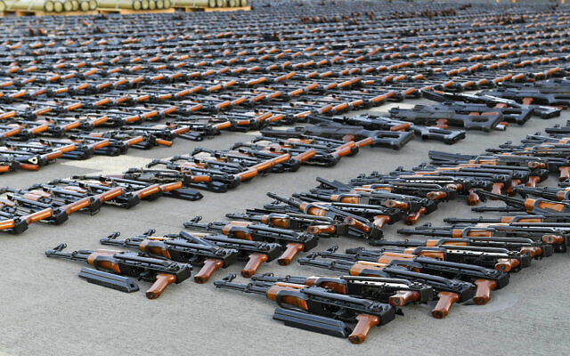 Assault rifles and missiles seized by the French navy lay on the deck of a ship at an undisclosed location February 1, 2023. (US military's Central Command via AP)