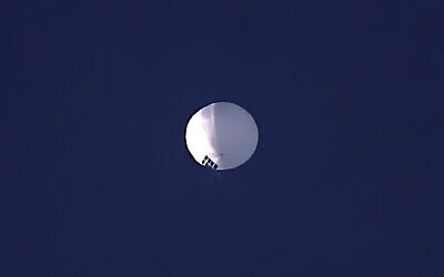 A high altitude balloon floats over Billings, Mont., on Wednesday, February 1, 2023. The US is tracking a suspected Chinese surveillance balloon that has been spotted over US airspace for a couple days, but the Pentagon decided not to shoot it down due to risks of harm for people on the ground, officials said Thursday, February 2, 2023. The Pentagon would not confirm that the balloon in the photo was the surveillance balloon. (Larry Mayer/The Billings Gazette via AP)