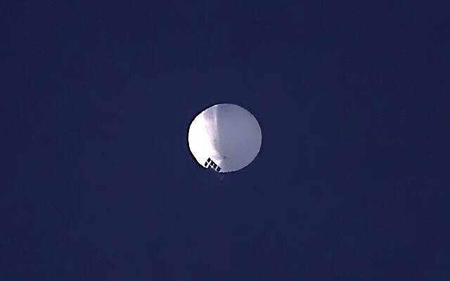 A high altitude balloon floats over Billings, Mont., on Wednesday, Feb. 1, 2023. The US is tracking a suspected Chinese surveillance balloon that has been spotted over US airspace for a couple days, but the Pentagon decided not to shoot it down due to risks of harm for people on the ground, officials said Thursday, Feb. 2, 2023. The Pentagon would not confirm that the balloon in the photo was the surveillance balloon. (Larry Mayer/The Billings Gazette via AP)