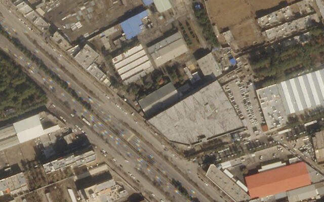 This satellite image from Planet Labs PBC shows damage on the roof of an Iranian military workshop, center, after a drone attack in Isfahan, Iran, Thursday, Feb. 2, 2023. (Planet Labs PBC via AP)