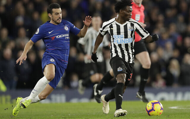 Chelsea's Pedro, left, and Newcastle United's Christian Atsu vie for the ball during the English Premier League soccer match between Chelsea and Newcastle United at Stamford Bridge stadium in London, on, January 12, 2019. (AP Photo/Matt Dunham, File)