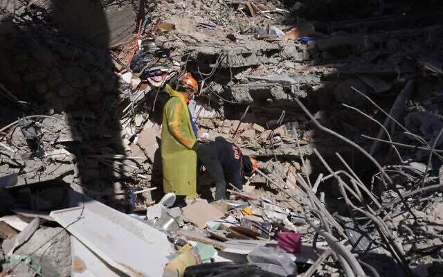 Illustrative: Emergency teams search for people in the rubble of a destroyed building in Adana, southern Turkey, February 7, 2023. (AP Photo/Hussein Malla)