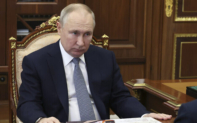 Russian President Vladimir Putin attends a meeting in Moscow, Russia, February 7, 2023. (Mikhail Klimentyev, Sputnik, Kremlin Pool Photo via AP)