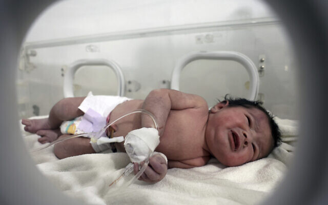 A baby girl who was born under the rubble caused by an earthquake that hit Syria and Turkey receives treatment inside an incubator at a children’s hospital in the town of Afrin, Aleppo province, Syria, Tuesday, Feb. 7, 2023. Residents in the northwest Syrian town discovered the crying infant, whose mother gave birth to her while buried underneath the rubble of a five-story apartment building leveled by this week’s devastating earthquake, relatives and a doctor say. (AP/Ghaith Alsayed)