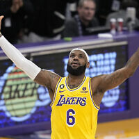 Los Angeles Lakers forward LeBron James celebrates after scoring to become the NBA's all-time leading scorer during the second half of a basketball game against the Oklahoma City Thunder, Los Angeles, February 7, 2023. (AP/Mark J. Terrill)