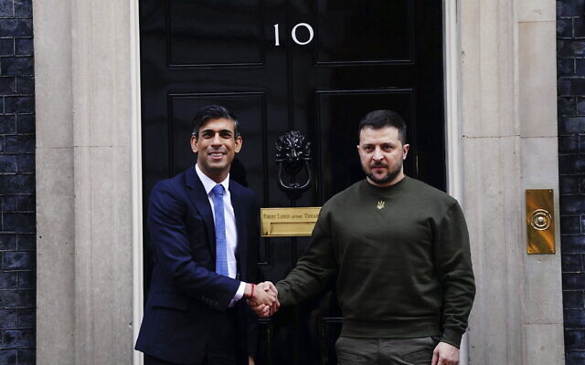 Britain's Prime Minister Rishi Sunak, left, welcomes Ukraine's President Volodymyr Zelensky at Downing Street in London, Feb. 8, 2023. (Victoria Jones/PA via AP)