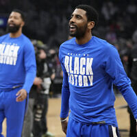 Dallas Mavericks guard Kyrie Irving warms up prior to an NBA basketball game against the Los Angeles Clippers, in Los Angeles, February 8, 2023. (Mark J. Terrill/AP)