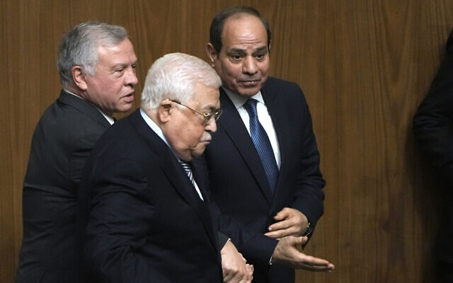 Egyptian President Abdel-Fattah el-Sissi, right, greets Palestinian President Mahmoud Abbas, center, and King Abdullah II of Jordan, during a conference at the Arab League headquarters in Cairo, Egypt, Sunday, Feb. 12, 2023. (AP Photo/Amr Nabil)