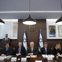 Prime Minister Benjamin Netanyahu, center, chairs the weekly cabinet meeting in Jerusalem, Feb.12, 2023. (AP Photo/Ohad Zwigenberg, Pool)