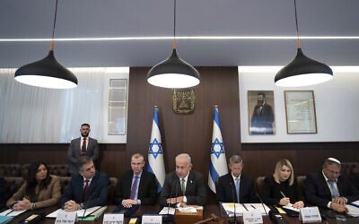 Prime Minister Benjamin Netanyahu, center, chairs the weekly cabinet meeting in Jerusalem, Feb.12, 2023. (AP Photo/Ohad Zwigenberg, Pool)