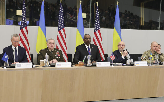 NATO Secretary General Jens Stoltenberg, United States Secretary of Defense Lloyd Austin, Ukraine's Defense Minister Kyrylo Budanov and Ukraine's Lieutenant General Yevhen Moisiuk, from left to right, are seen during the North Atlantic Council round table meeting of NATO defense ministers at NATO headquarters in Brussels, Tuesday, Feb. 14, 2023. (AP Photo/Olivier Matthys)