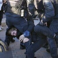 Russian police detain an antiwar protester in St. Petersburg, Russia, Saturday, September 24, 2022. (AP Photo, File)