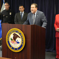 Jeffrey Abrams, Regional Director of Anti-Defamation League, ADL Los Angeles, at podium, denounces antisemitism and hate crimes at a news conference at the US Attorney's Office Central District of California offices in Los Angeles Friday, February 17, 2023. From left, United States Attorney Martin Estrada and Los Angeles Mayor Karen Bass. (AP Photo/Damian Dovarganes)