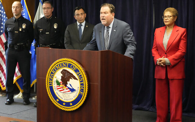 Jeffrey Abrams, Regional Director of Anti-Defamation League, ADL Los Angeles, at podium, denounces antisemitism and hate crimes at a news conference at the US Attorney's Office Central District of California offices in Los Angeles Friday, February 17, 2023. From left, United States Attorney Martin Estrada and Los Angeles Mayor Karen Bass. (AP Photo/Damian Dovarganes)