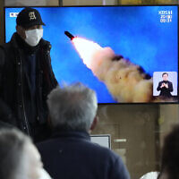 A TV screen shows a file image of North Korea's missile launch during a news program at the Seoul Railway Station in Seoul, South Korea, Monday, Feb. 20, 2023. (AP/Ahn Young-joon)