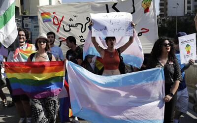 LGBTQ activists in Lebanon shout slogans as they march calling on the government for more rights in the country gripped by economic and financial crisis during ongoing protests in Beirut, Lebanon on June 27, 2020. (AP Photo/Hassan Ammar, File)