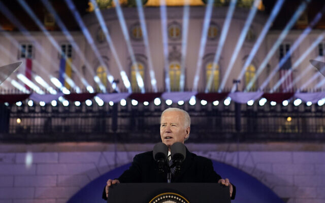 US President Joe Biden delivers a speech marking the one-year anniversary of the Russian invasion of Ukraine, Tuesday, February 21, 2023, at the Royal Castle Gardens in Warsaw. (AP Photo/ Evan Vucci)