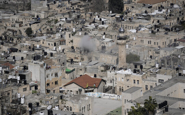 Smoke rises as Palestinians clash with Israeli forces in the West Bank city of Nablus, February 22, 2023. (AP Photo/Majdi Mohammed)