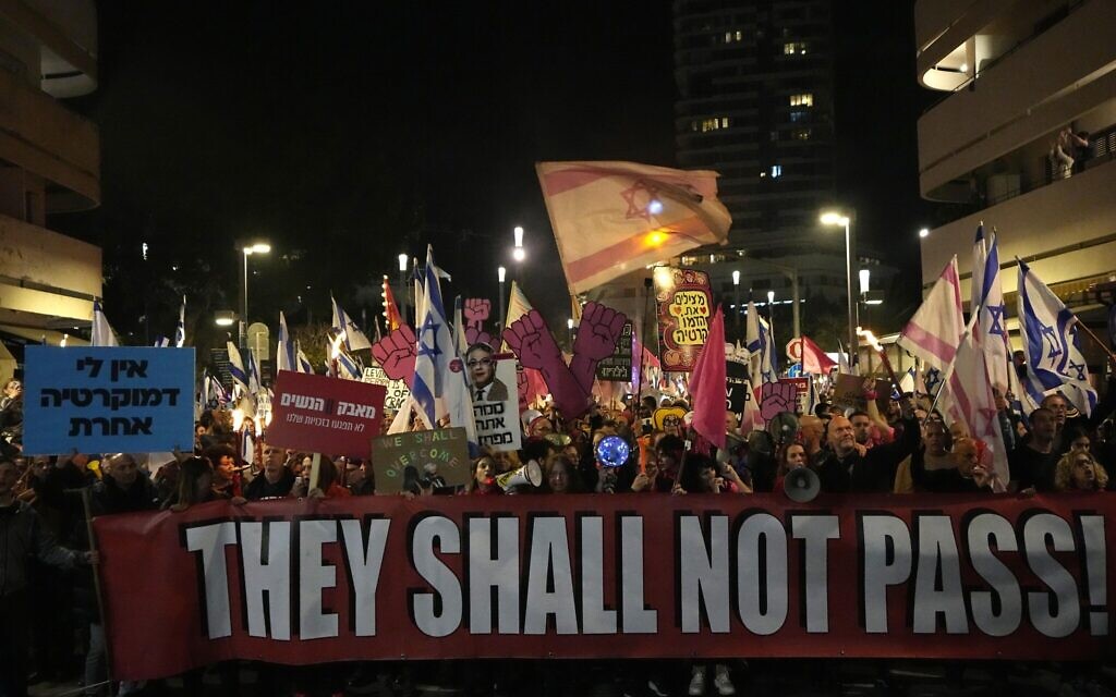 Israelis protest plans by the government to overhaul the judicial system, in Tel Aviv, Feb. 25, 2023. (AP Photo/ Ariel Schalit)