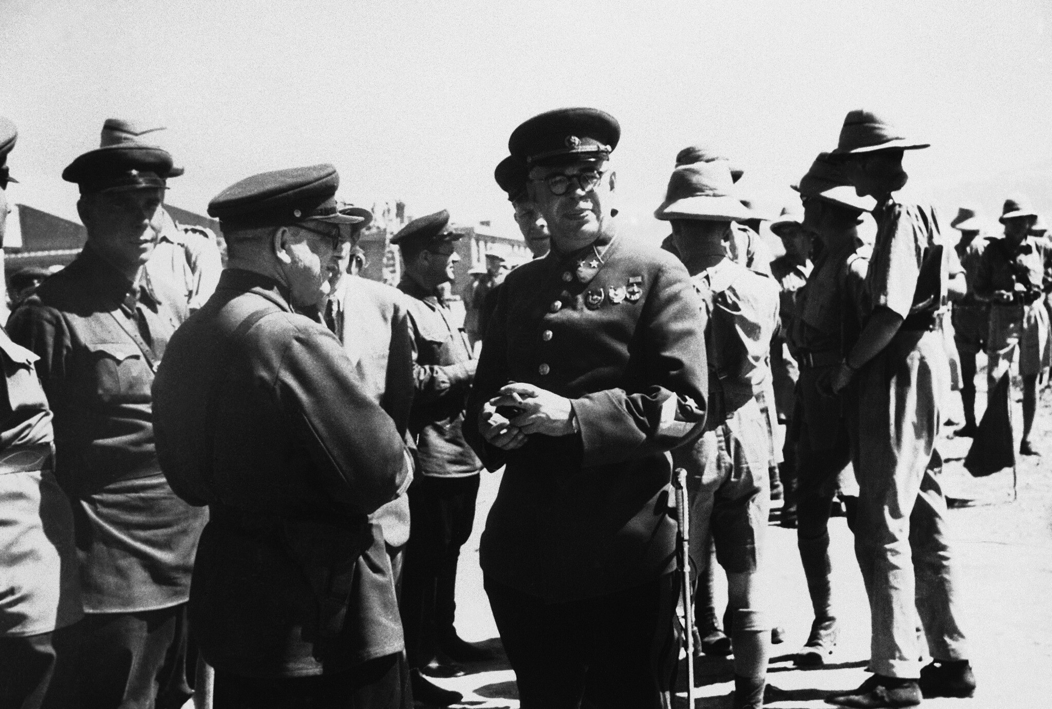 Major General Vassili Vassilovich Novikov, commanding Russian forces in North Iran, center, facing camera, watching a review of his and British troops in Tehran, Iran on November 5, 1941. (AP Photo)