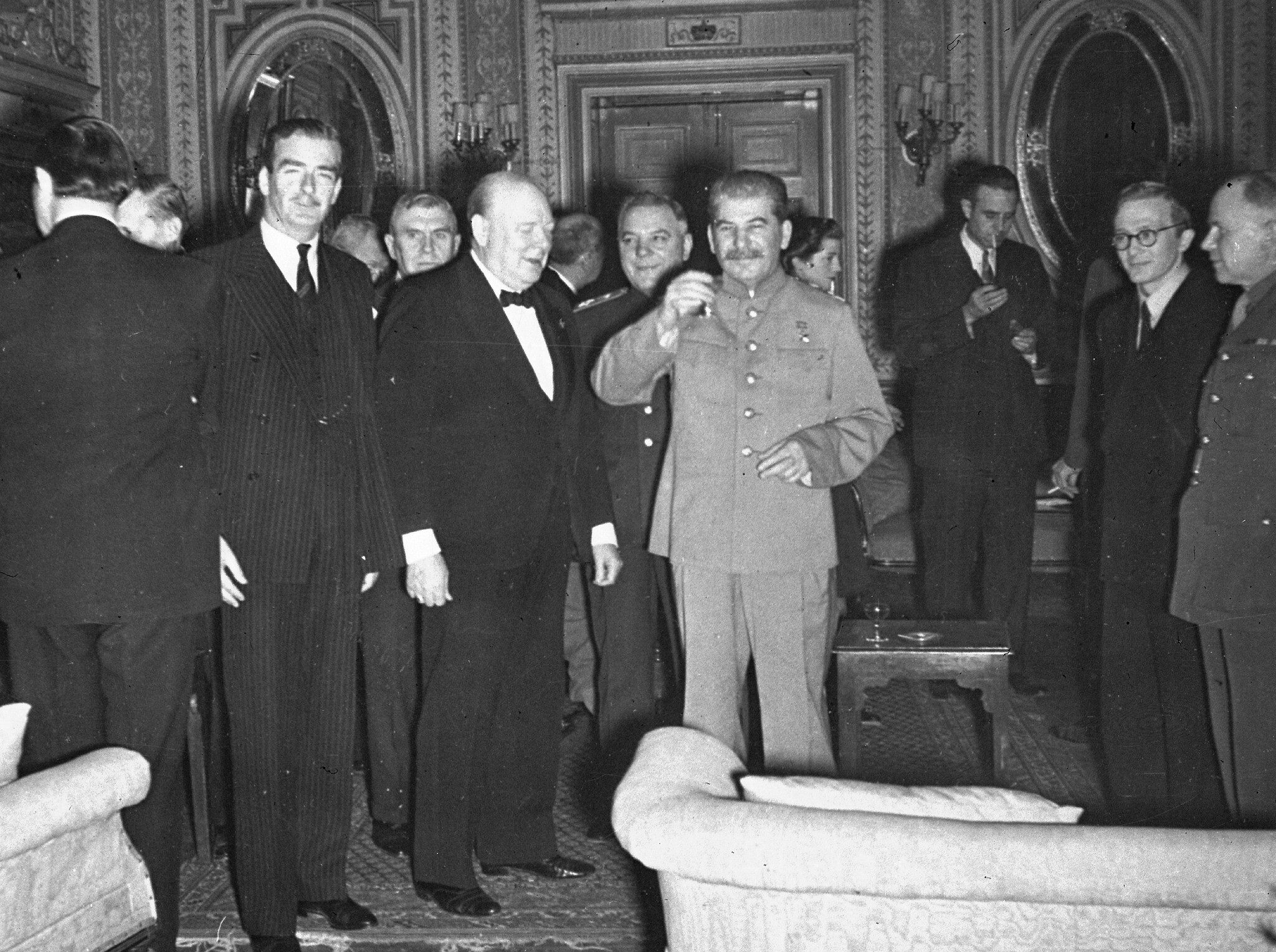 Joseph Stalin, standing with Winston Churchill and British foreign minister Anthony Eden, makes at toast at Churchill's 69th birthday party in Tehran, Iran, November 30, 1943. (AP Photo)