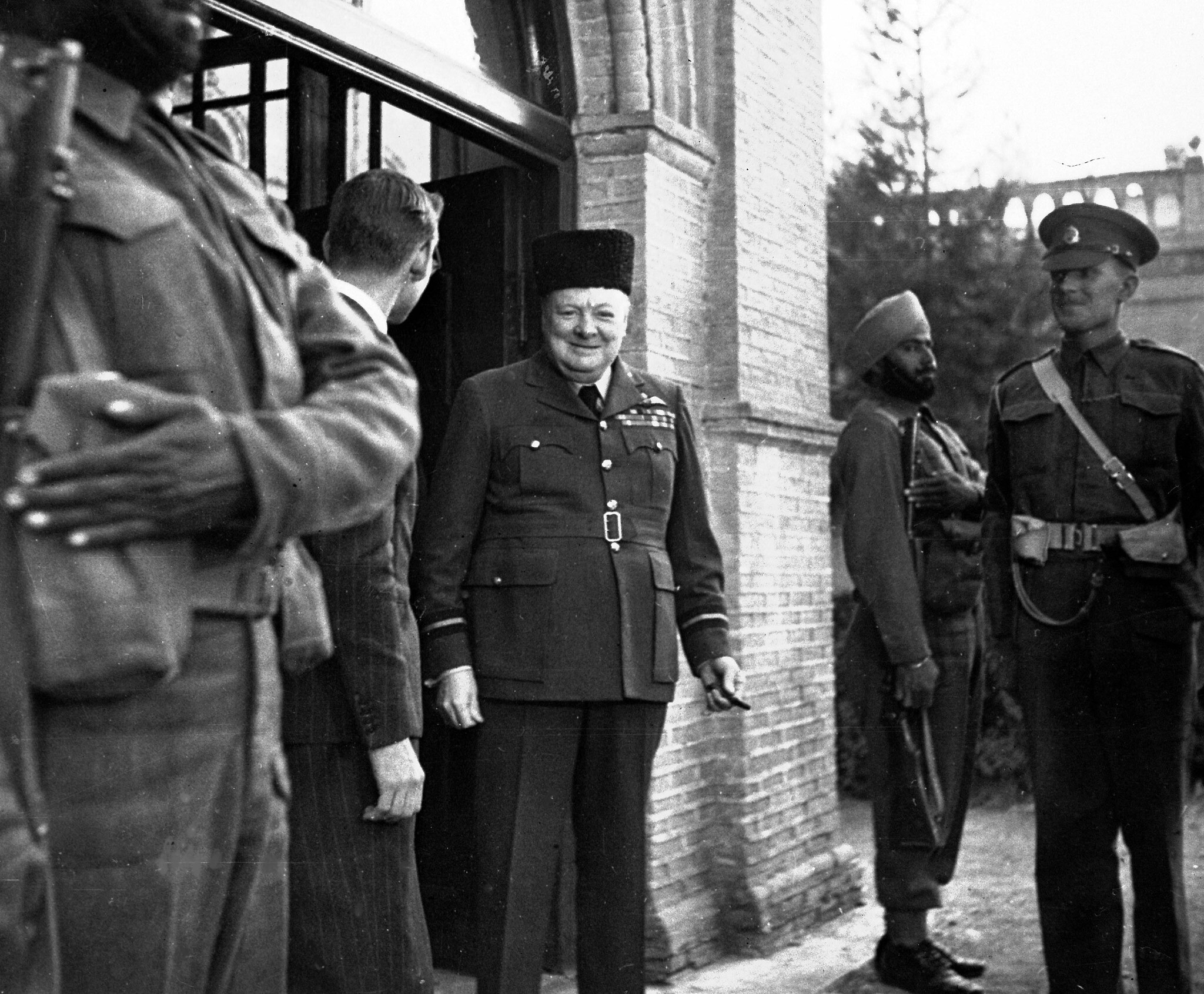 Winston Churchill wears a caracul hat, presented to him by the British Press Unit to mark his 69th birthday in Tehran, Iran, November 30, 1943. (AP Photo)