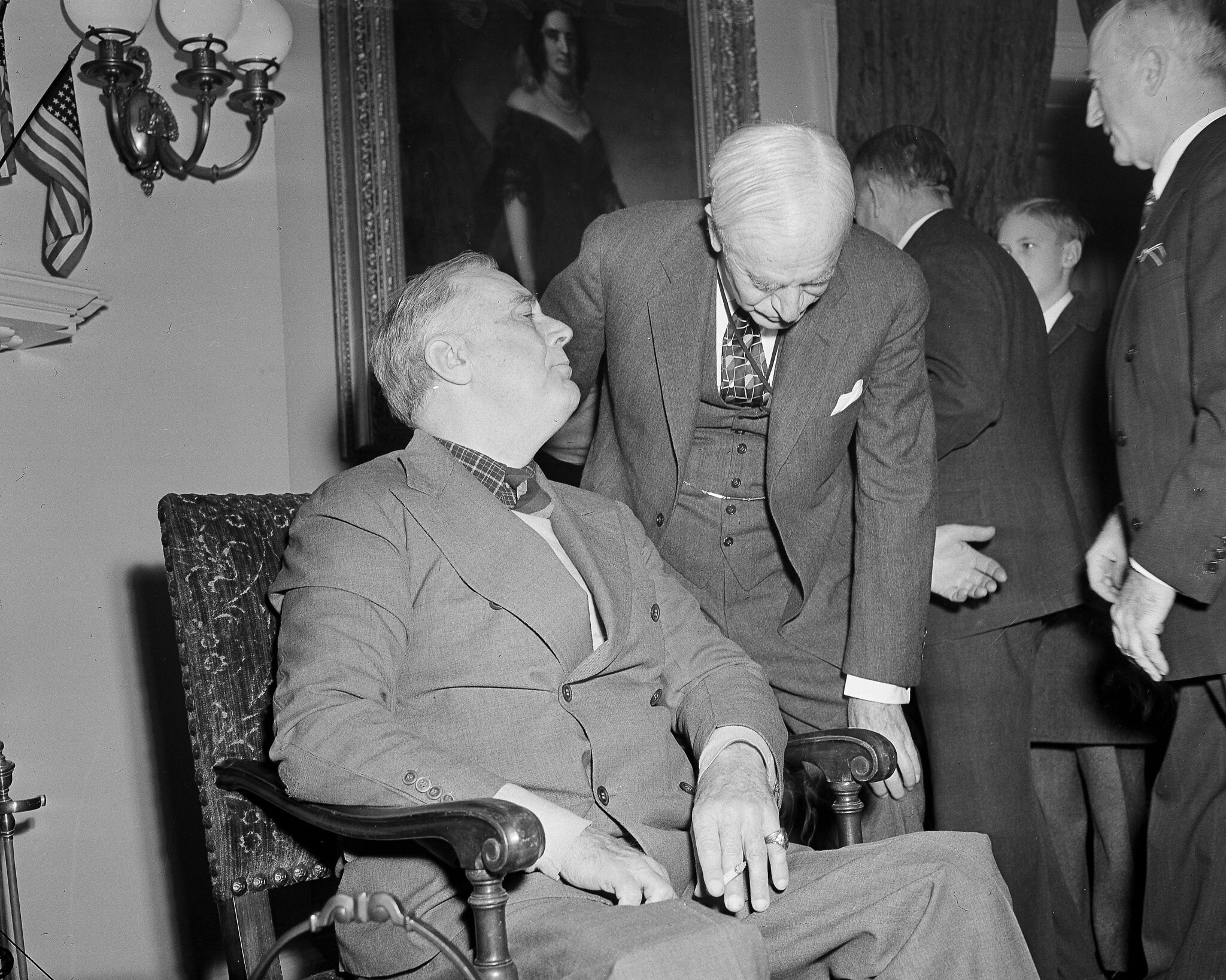 President Franklin D. Roosevelt, just home from historic conferences in Cairo and Tehran, talks in the White House, December 17, 1943, with Secretary of State Cordell Hull.  (AP Photo/Byron Rollins)