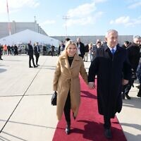 Prime Minister Benjamin Netanyahu and his wife, Sara, depart for a trip to Paris on February 2, 2023. (Amos Ben-Gershom/GPO)