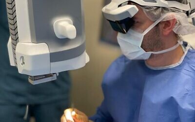 A doctor uses the Beyeonics One headset to assist with eye surgery. (Courtesy of Beyeonics)