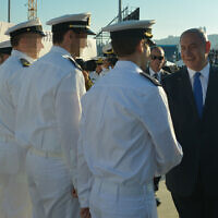 A government handout shows Israeli Prime Minister Benjamin Netanyahu greeting sailors at a welcoming ceremony for the new Rahav submarine in Haifa, on January 12, 2016. (Kobi Gideon/GPO)