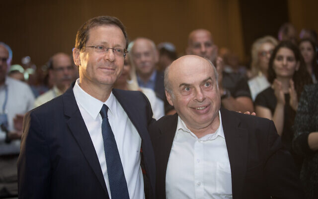 File: Then-incoming Jewish Agency Chairman Isaac Herzog with outgoing chairman Natan Sharansky, at the board of governors conference of the Jewish Agency, at the Orient Hotel in Jerusalem, on June 24, 2018. (Hadas Parush/Flash90)