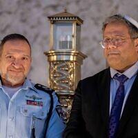 Otzma Yehudit chief Itamar Ben Gvir (R) and Israel Police Commissioner Yaakov Shabtai attend a Hanukkah ceremony at the Western Wall in Jerusalem's Old City, December 19, 2022. (Yonatan Sindel/Flash90)