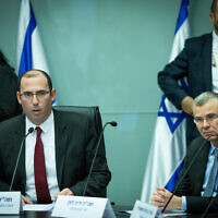 MK Simcha Rothman, head of the Knesset's Constitution, Law and Justice Committee, left, and Justice Minister Yariv Levin attend a committee meeting at the Knesset in Jerusalem on January 11, 2023. (Yonatan Sindel/Flash90)